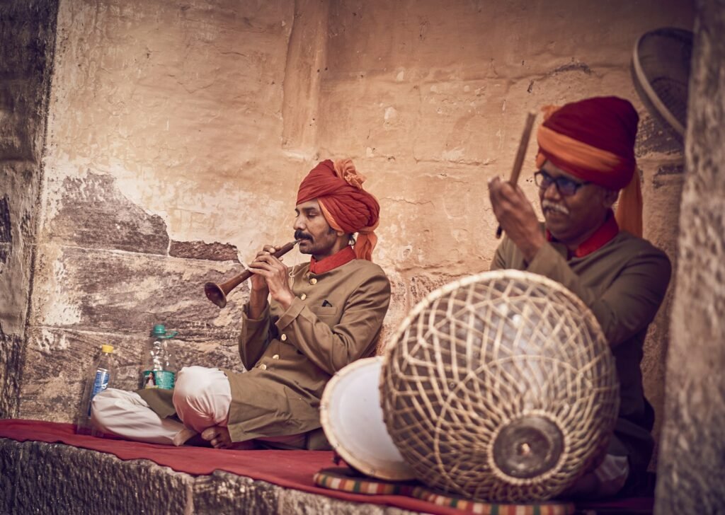 A couple of men sitting next to each other